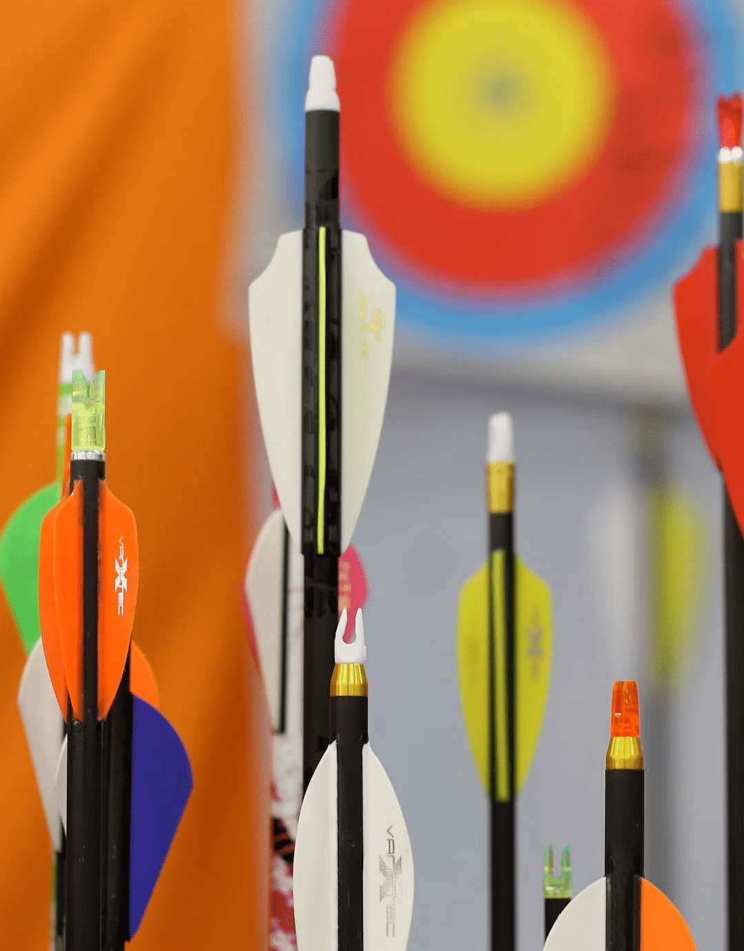 Close-up of colourful arrows in a quiver, ready for archery at Nirantara Resort & Spa.