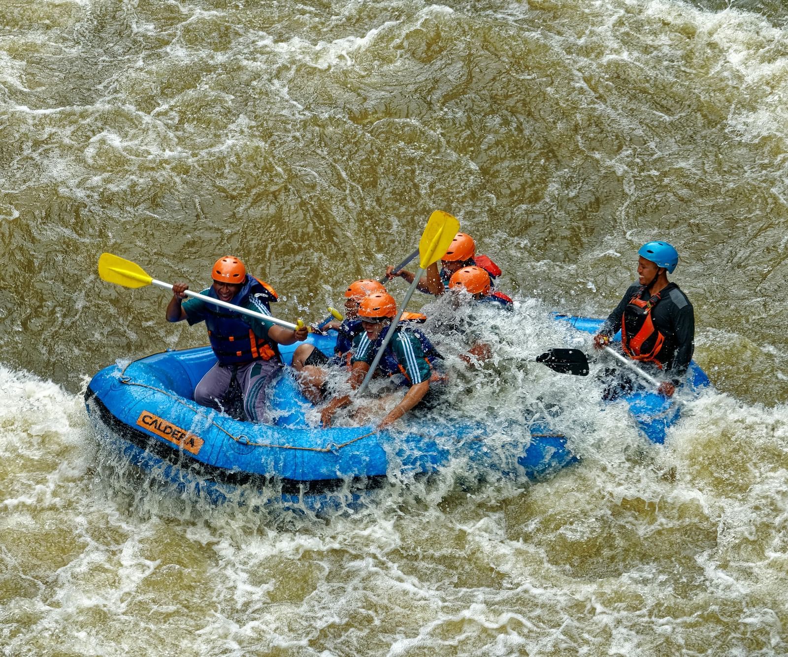 A photo of a group engaging in river rafting.