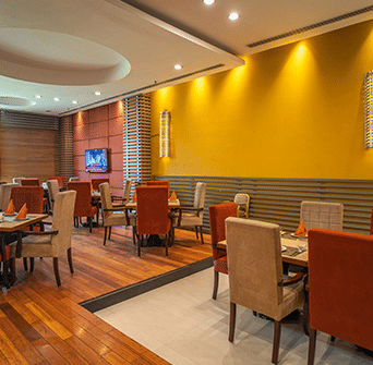 Seating arrangement inside a Spice Route, one of the best restaurants in Ludhiana, at Nirvana Luxury Hotel, Ludhiana.
