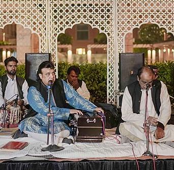 Musicians playing Qawali sitting on a stage at Nirvana Luxury Hotel, Ludhiana.