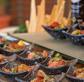 A close-up shot of various dishes placed on a table at Nirvana Luxury Hotel, Ludhiana.