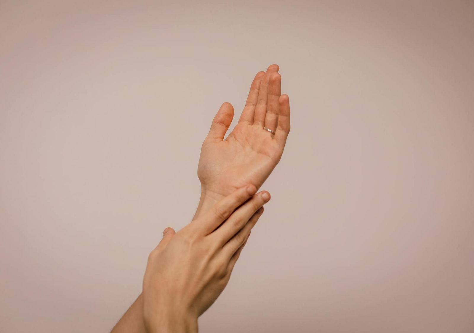 Hands gently placed one below the other