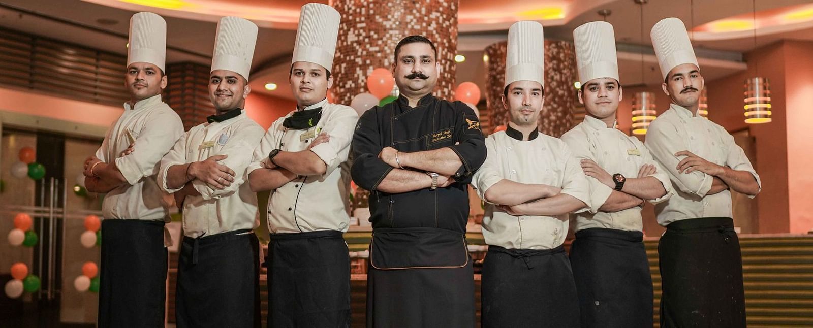 A group of chefs standing at Nirvana Luxury Hotel, Ludhiana.