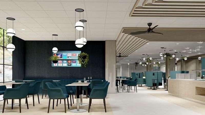 A bright, welcoming dining hall with minimalist design and comfortable seating.