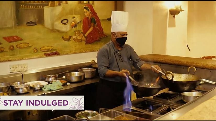 a chef cooking at orchid hotel mumbai vile parle