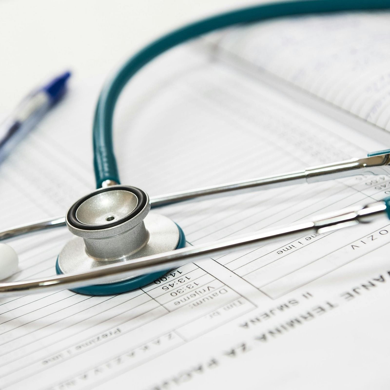 Prescription, stethoscope, and pen on a table