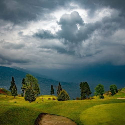 lush green deolo hills under an overcast sky