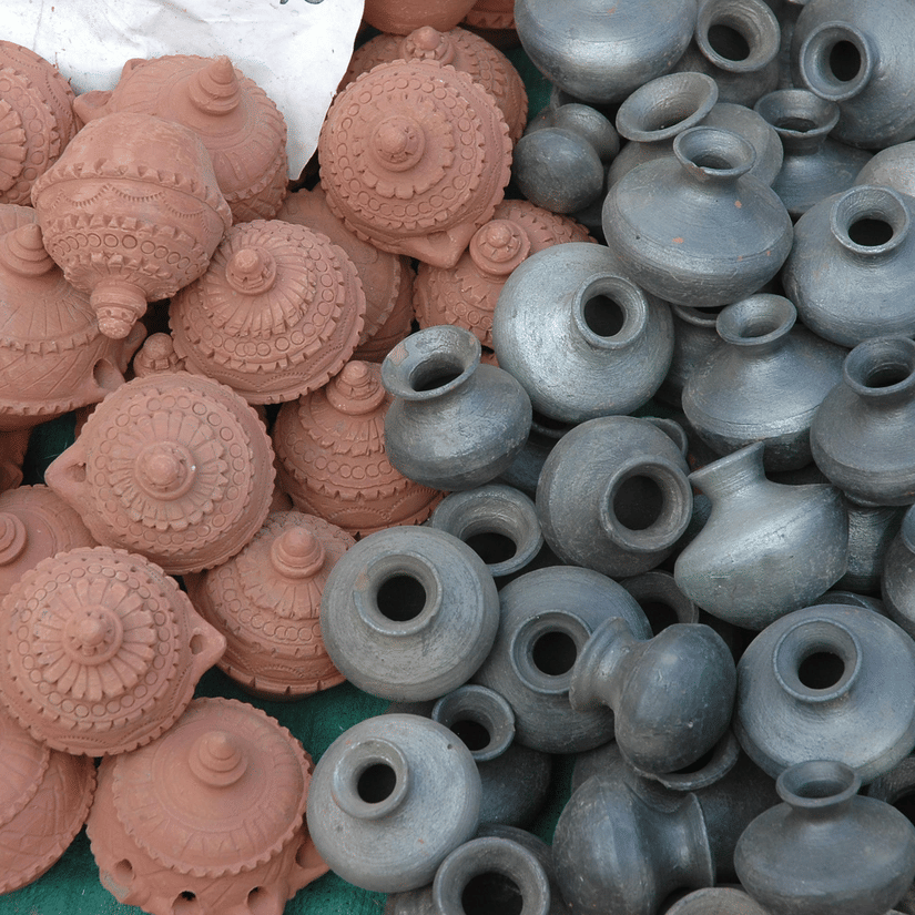 A large pile of grey and terracotta-coloured pottery items is shown | Famous things to buy in Calcutta