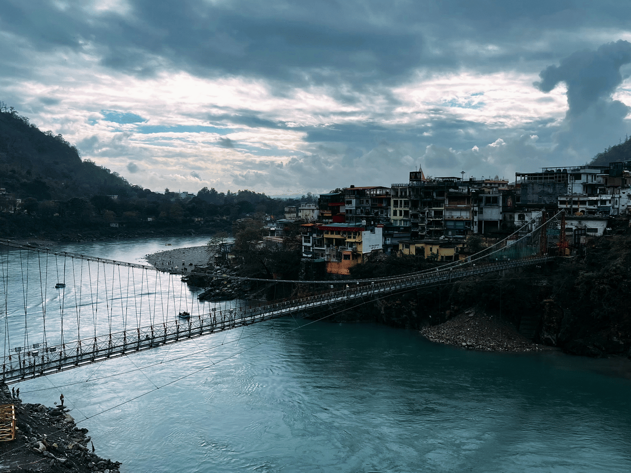 View of Lakshman Jhula bridge in Rishikesh over the ganges near Neemrana The Glasshouse on The Ganges.