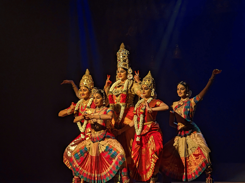A group of classical dancers performing on stage .