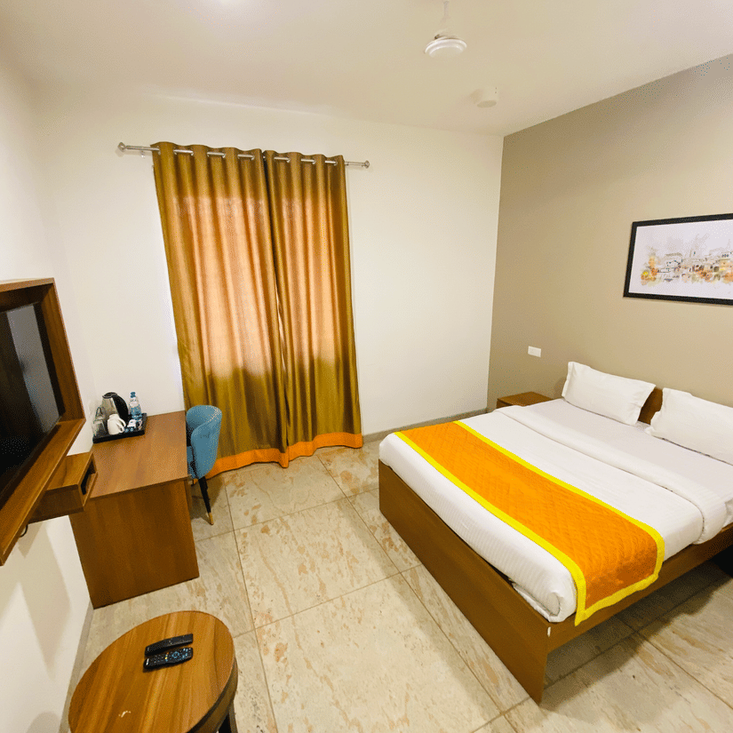 Super Deluxe Room side view double bed and wardrobe - Southern Grand Kashi