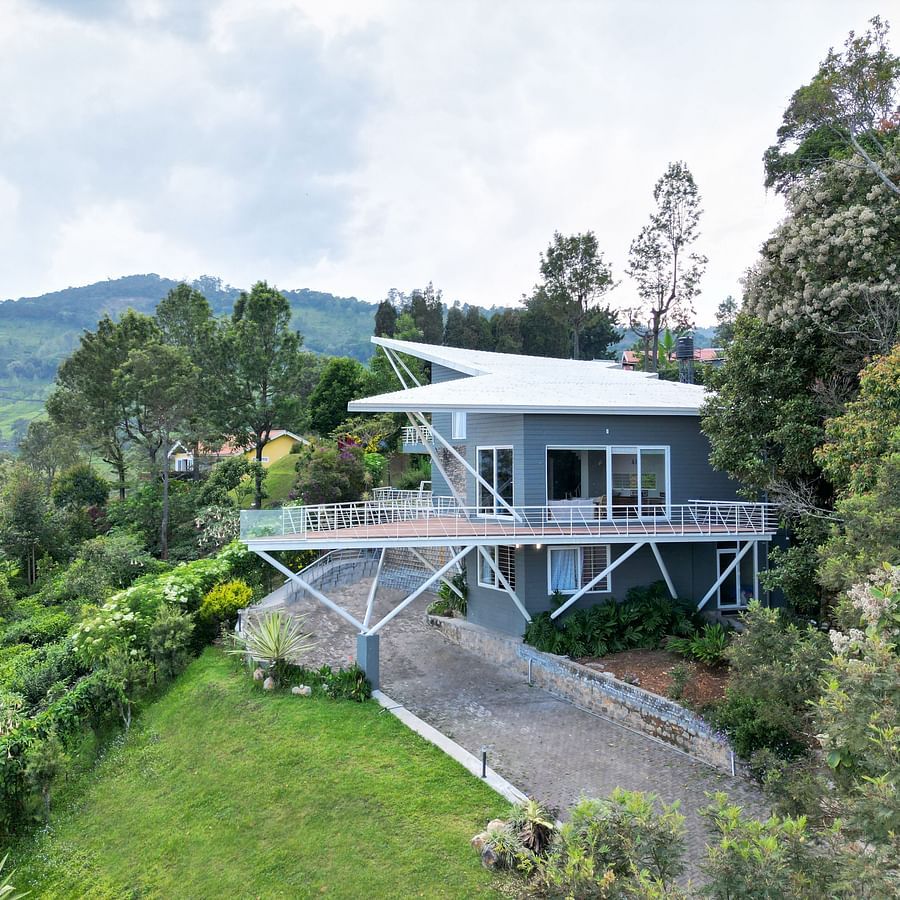 Contemporary resort surrounded by lush greenery and a well-kept lawn at Ibex Resort, Coonoor (Tapas).