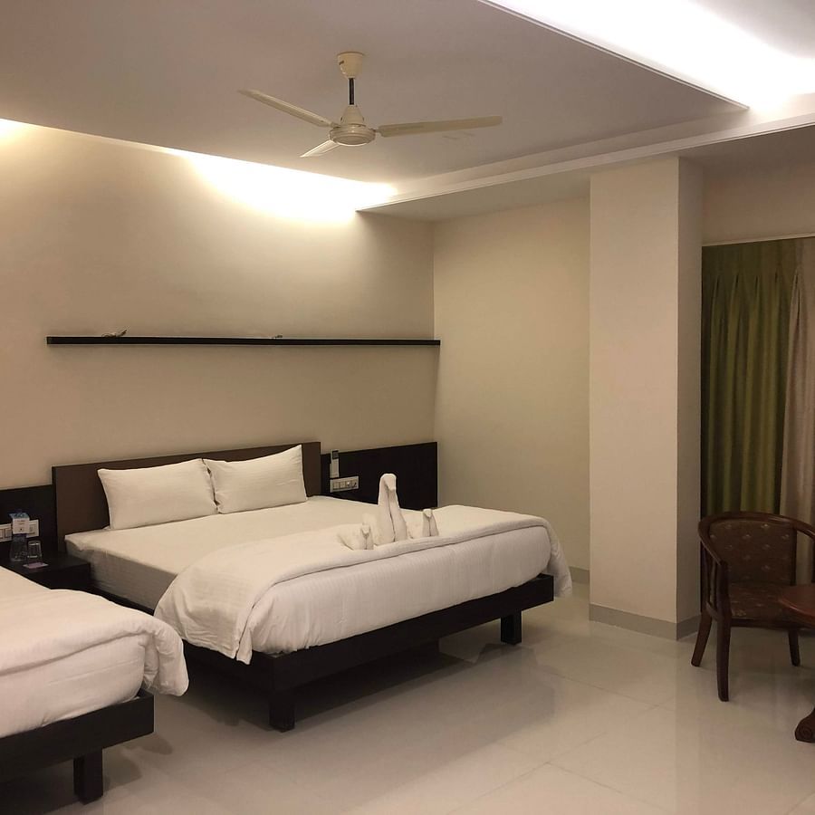 Premier room with two king size beds and chairs