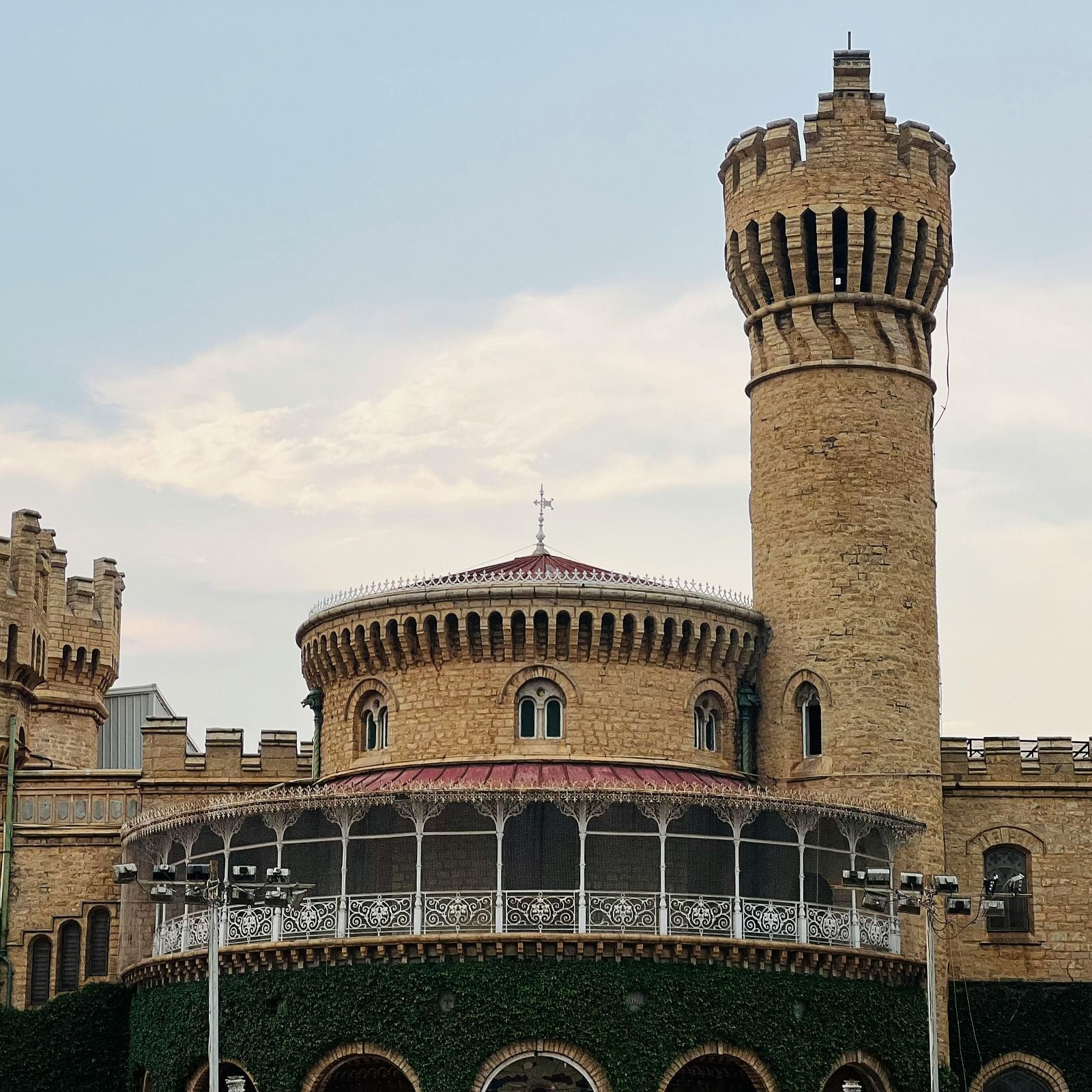 a beautiful facade view of a palace taken during an evening