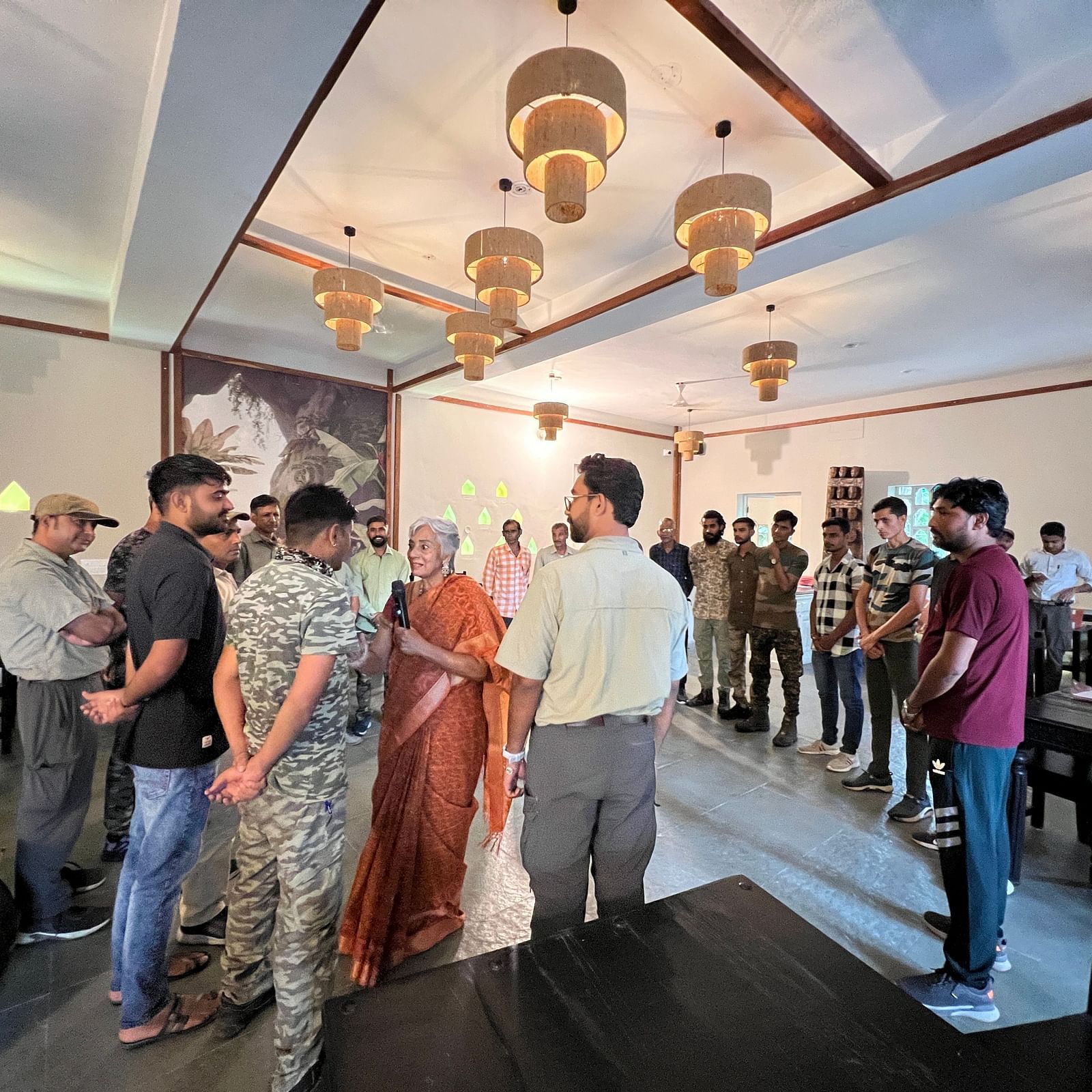 Our meeting hall in Sariska with a presenter talking to an attendee