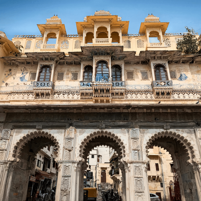 The ornate entrance facade of Bagore Ki Haveli with intricate Rajput architecture in Udaipur