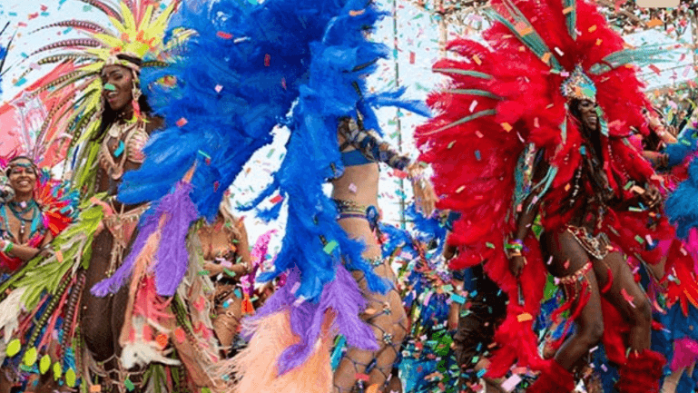 A close-up of vibrant, colourful feathers, possibly part of a costume or decoration.