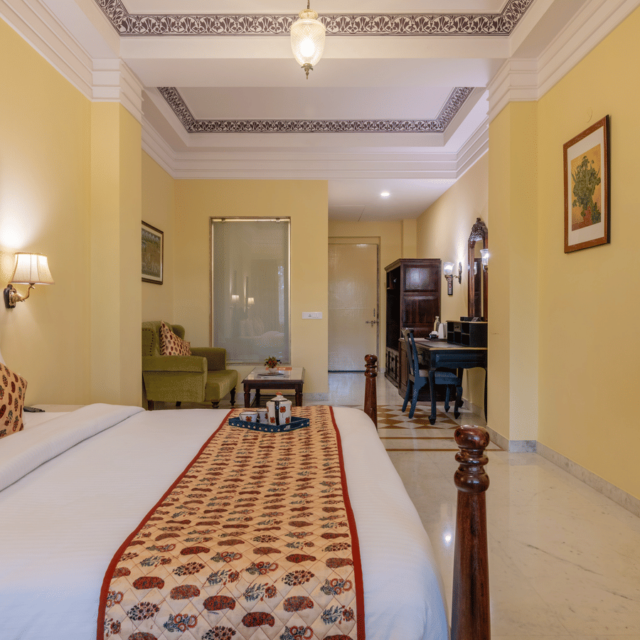 A spacious, traditional guest room at Umaid Palace, providing a comfortable and royal stay near Delhi.