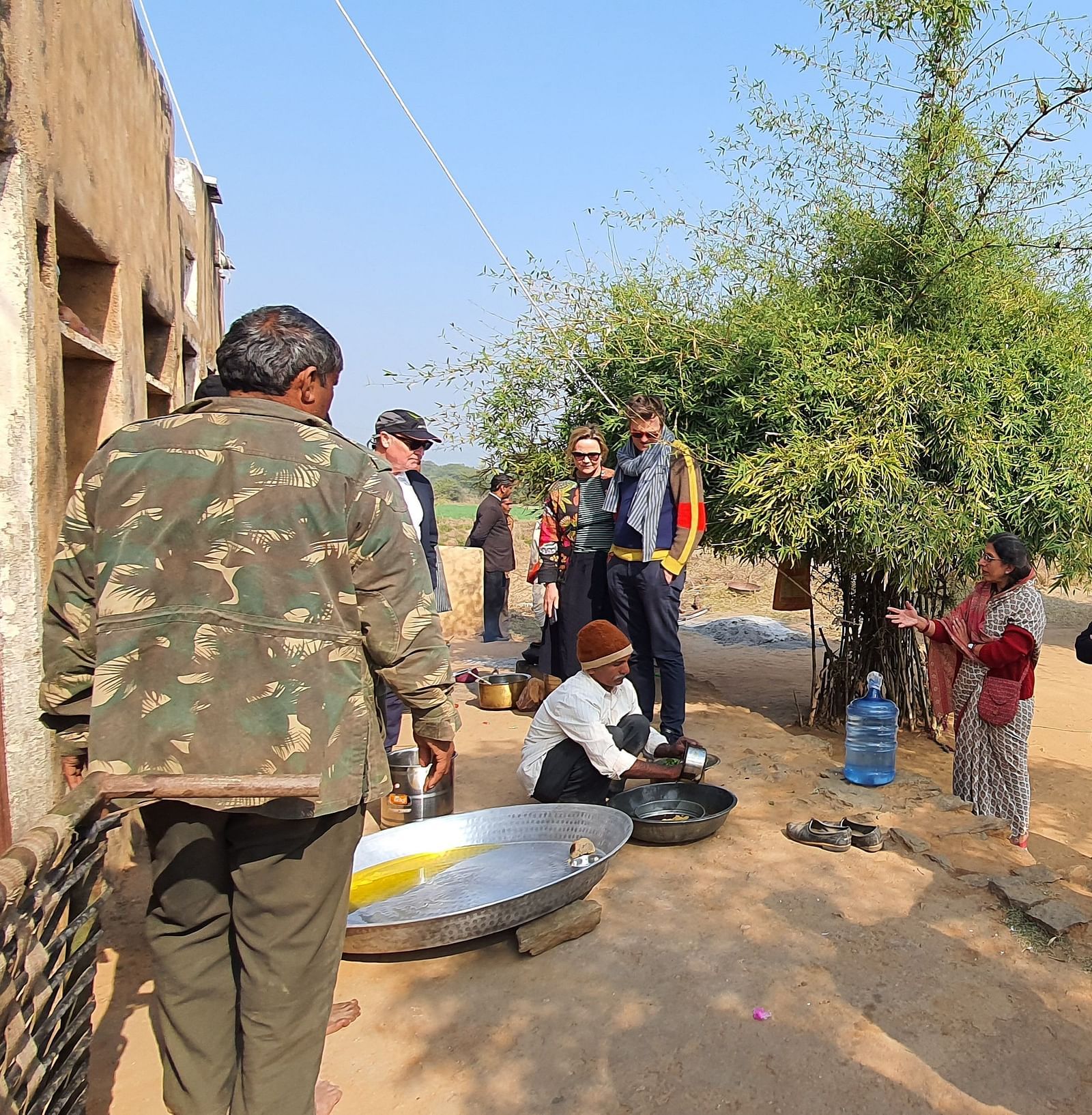 image of a group of tourists visiting a local school at dev shree, deogarh
