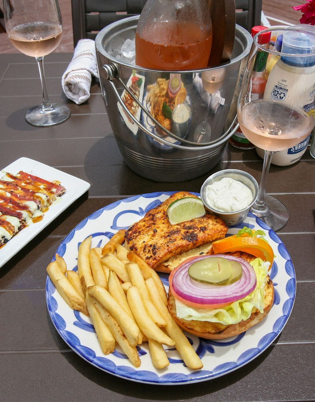 Lunch plate with fries, burger, and salad on a restaurant table | Abaco Inn