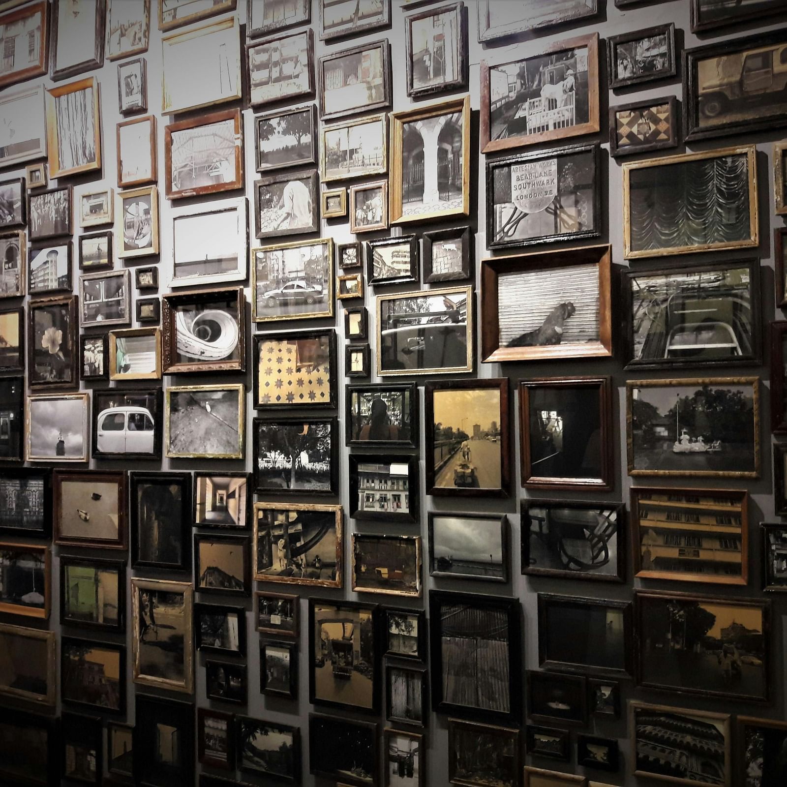 A wall entirely displayed with lot of photos each telling a story.