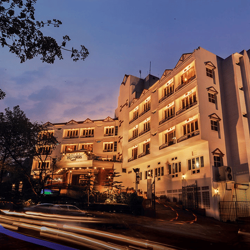 the exterior facade of Polo Towers hotel in Shillong with the evening sky in the background