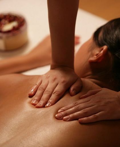 A soothing massage in a tranquil setting, highlighting relaxation and wellness. A perfect escape for rejuvenation | Brewery Gulch Inn & Spa