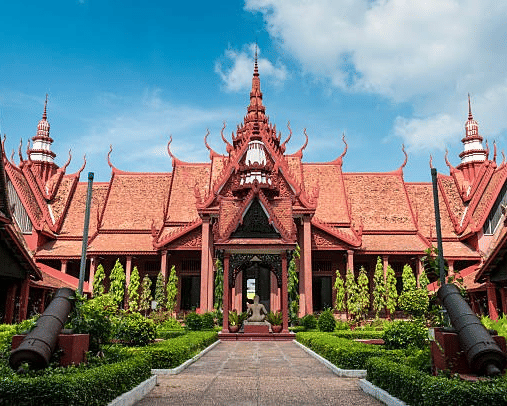 Traditional red terracotta building of the National Museum of Cambodia, housing Khmer art near Central Mansions.