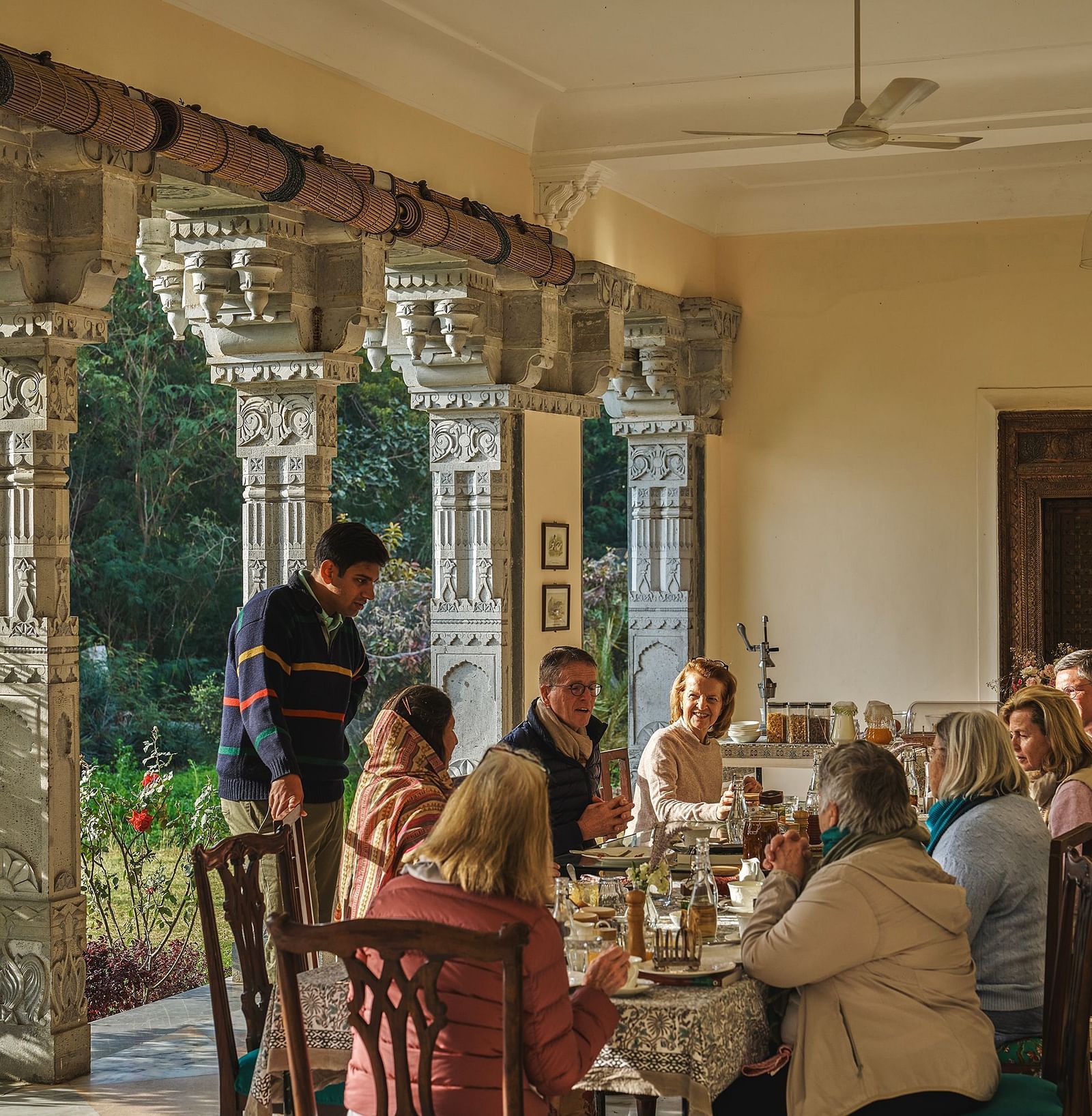an image of people having food in the dining space at dev shree, deogarh