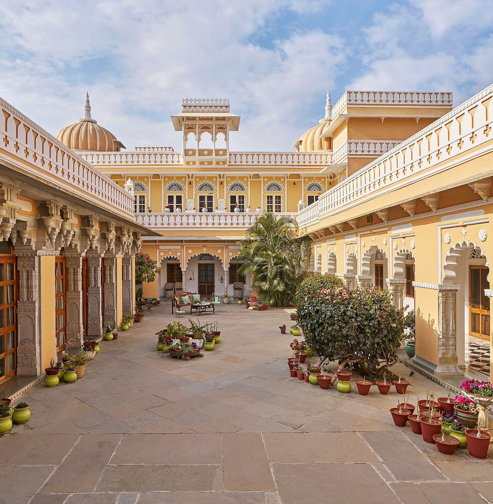 exterior image of dev shree, deogarh  with a beautiful sky with clouds in the background