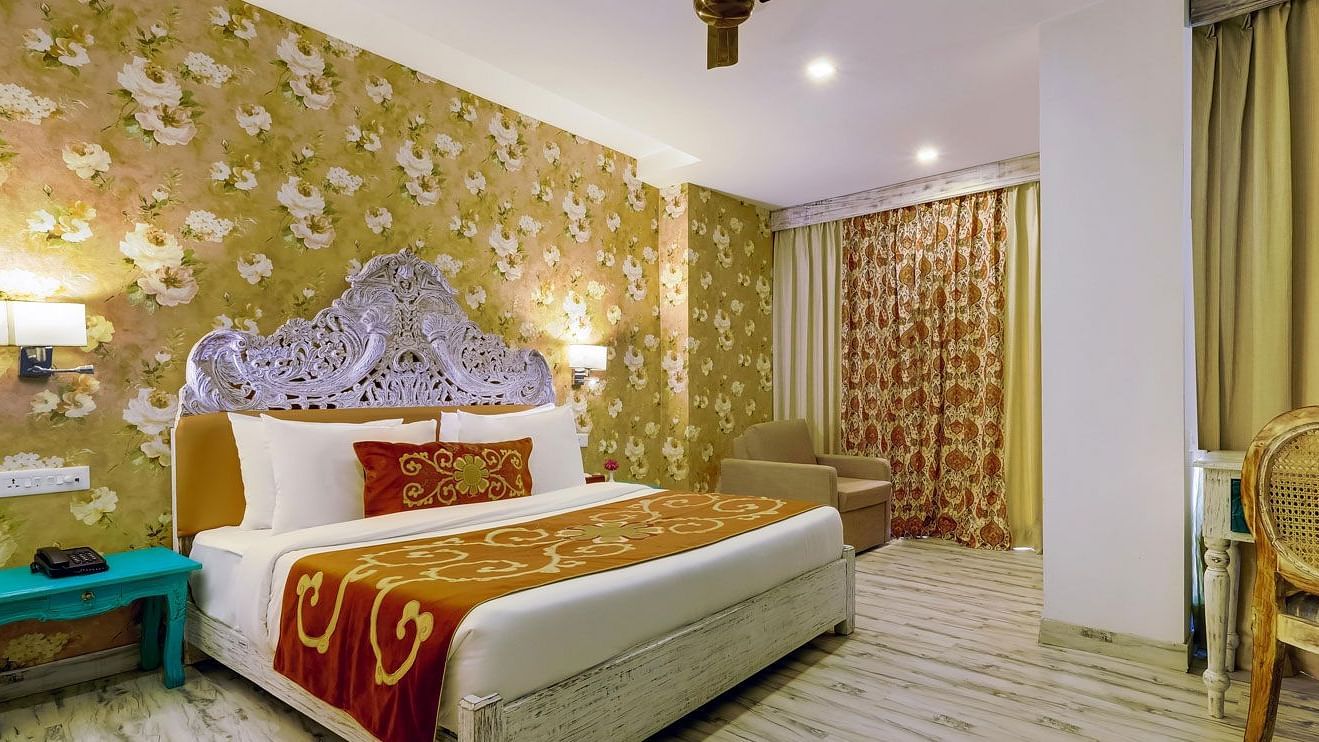 Image of a room wuth bed ans sitting area at Summit By The Ganges Beach Resort & Spa, Rishikesh