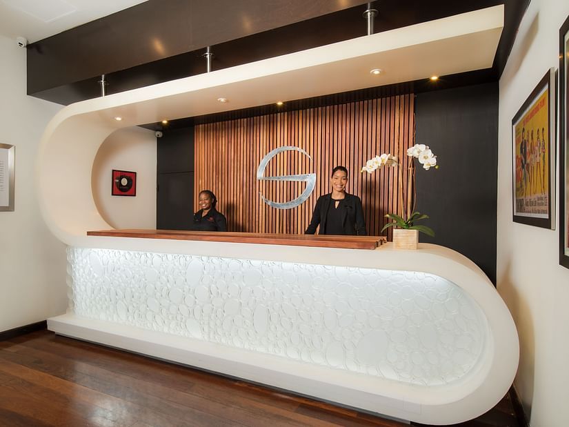Hotel reception area with sleek lighting and wood accents - S Hotel Kingston, Jamaica