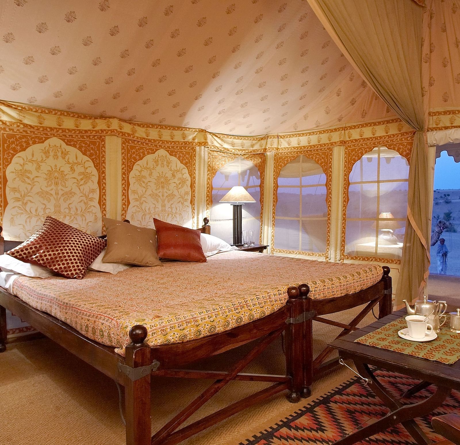 Interiors of the standard tent with a double bed and side tables