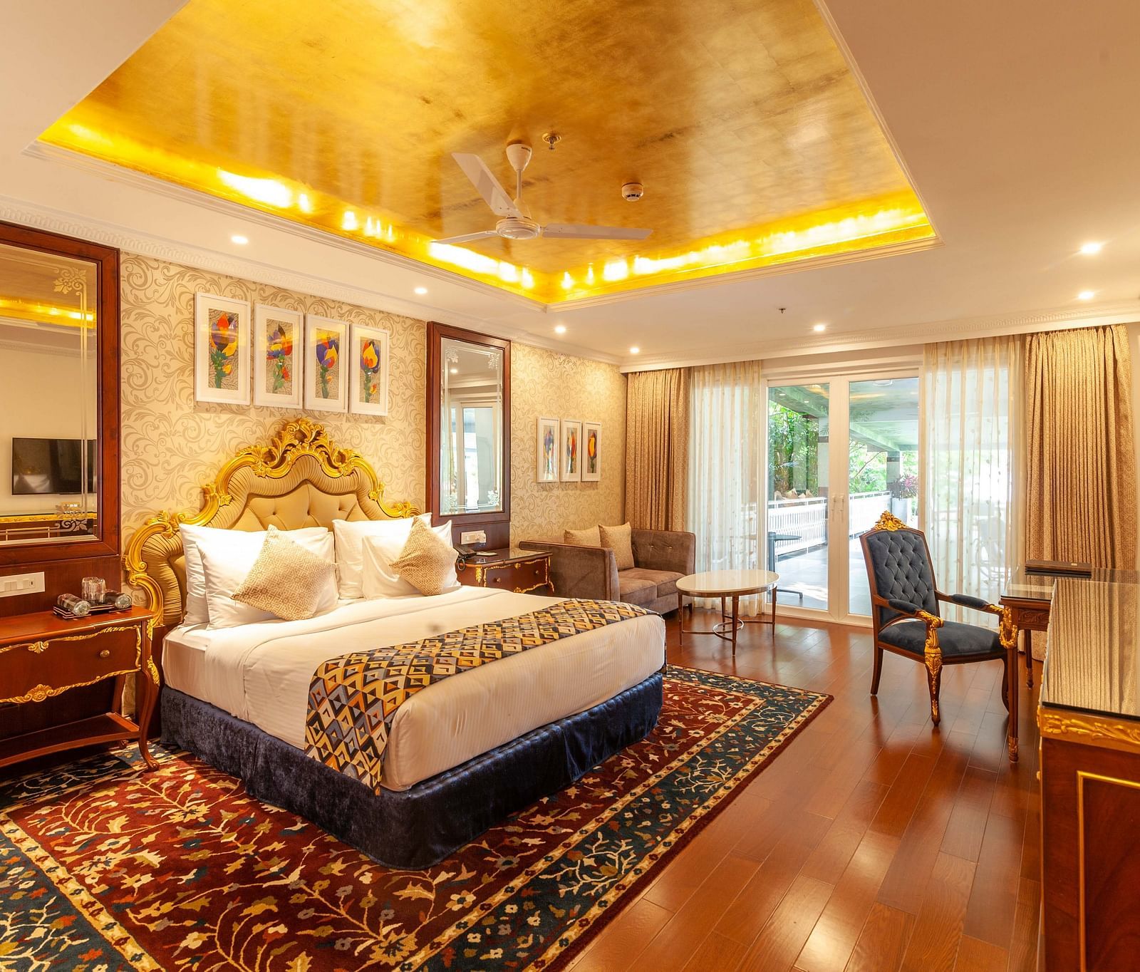 a king size bed facing the TV and a dressing mirror on its left - Mayfair Lake Resort, Raipur