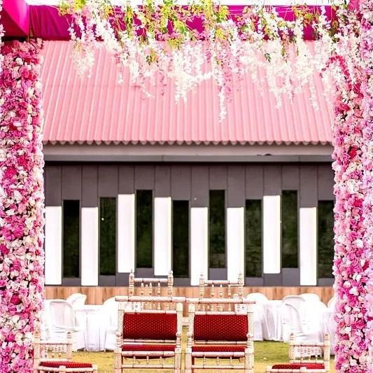 A decorated wedding setup in the lawn setting at Daksh Resort & Amusement Park.
