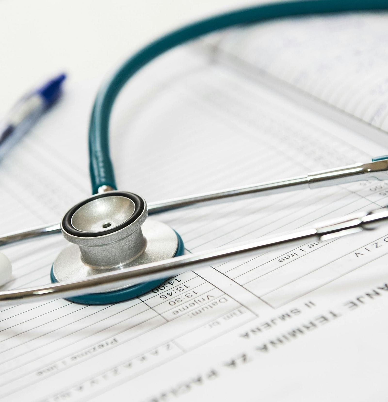 Prescription, stethoscope, and pen on a table