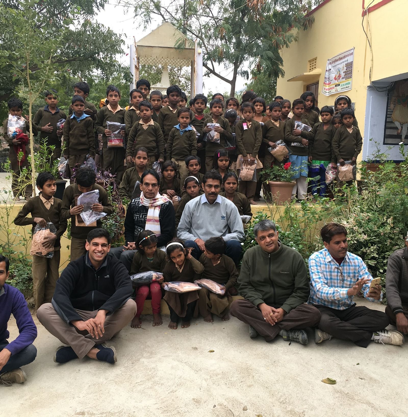 an group photo featuring the Founders of Dev Shree, deogarh at a school for during a CSR activity