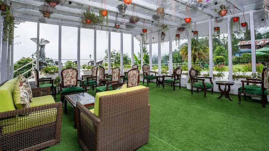 Open-air dining arrangement at Summit Barsana Resort & Spa, Kalimpong