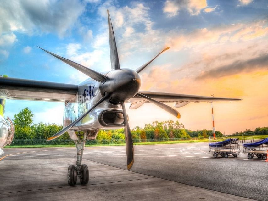 Picture of a helicopter with colourful sky in the background.