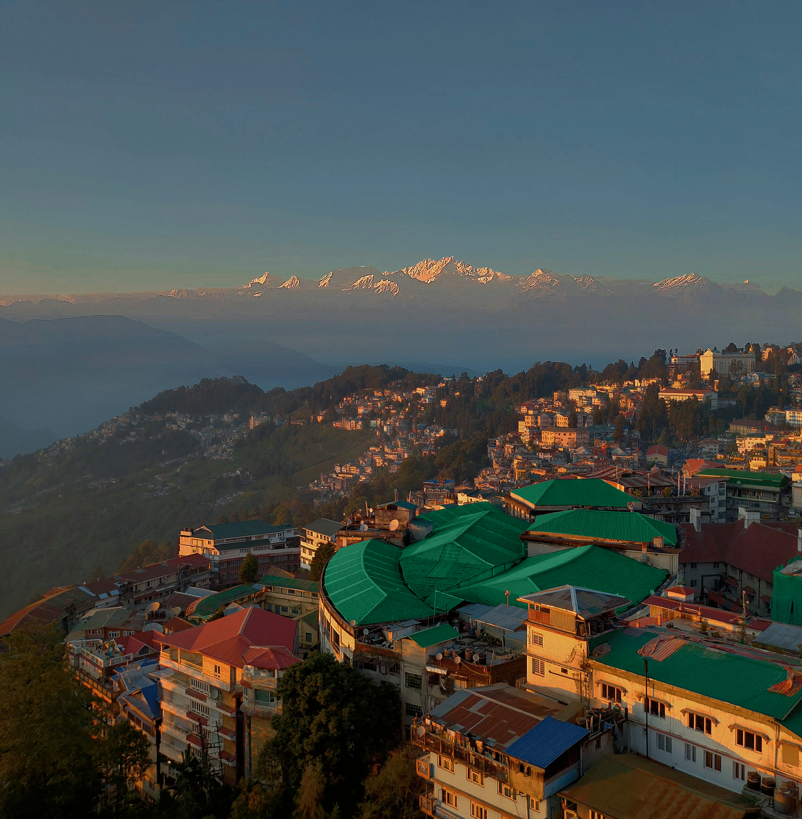 A stunning aerial view of Summit Montana Suites & Spa, Mall Road, with a picturesque sunset sky in the background