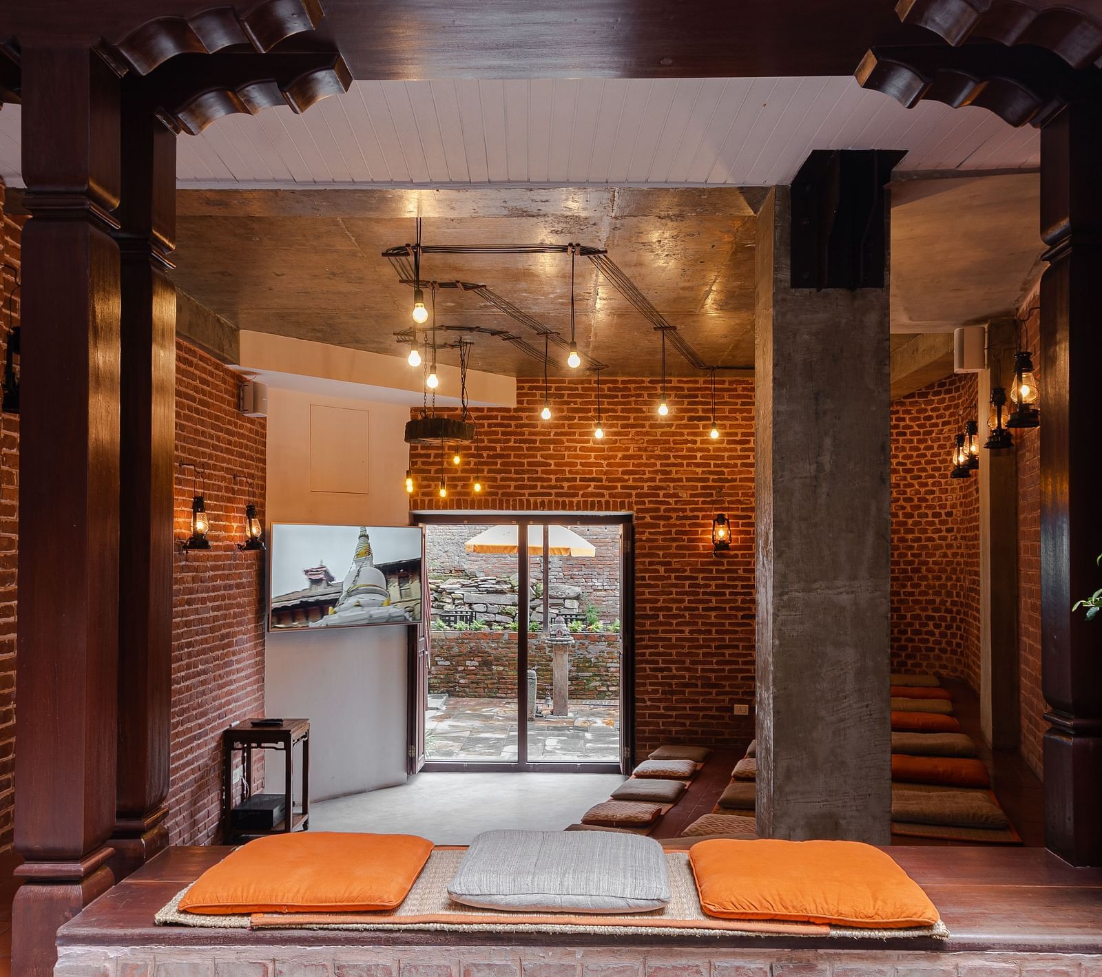 A seating area at The Nanee is elegantly adorned with soft lighting.