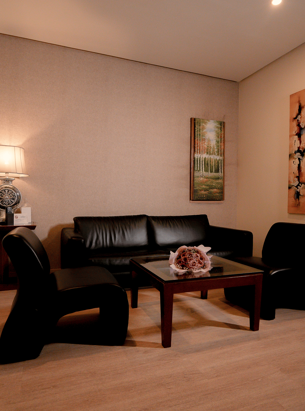 Hotel living area with sofa set, coffee table, and decorative artwork - Narayani Heights Hotel & Resorts