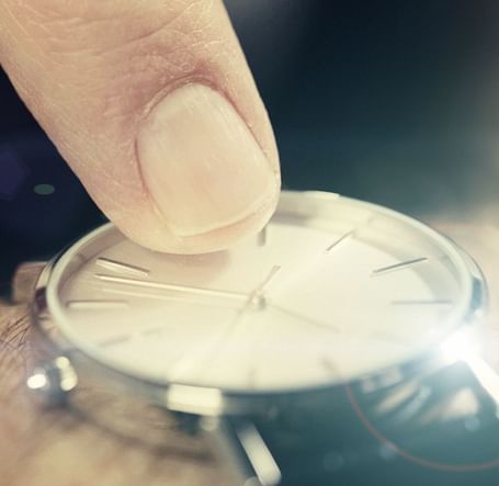 A hand pointing time on a watch - Brewery Gulch Inn & Spa