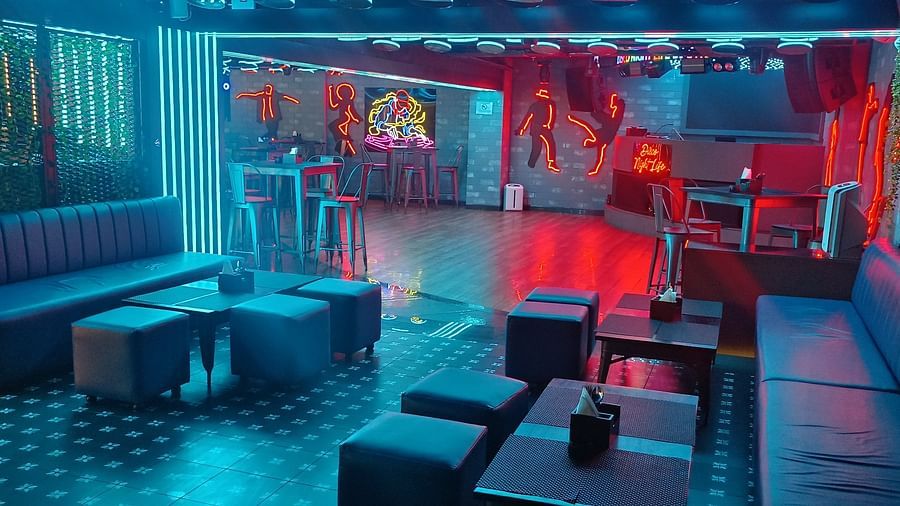 Disco Night Life at Wonder Country Club and Resort, Kharagpur, featuring cosy sofa seating, neon lighting, and stylish table setup