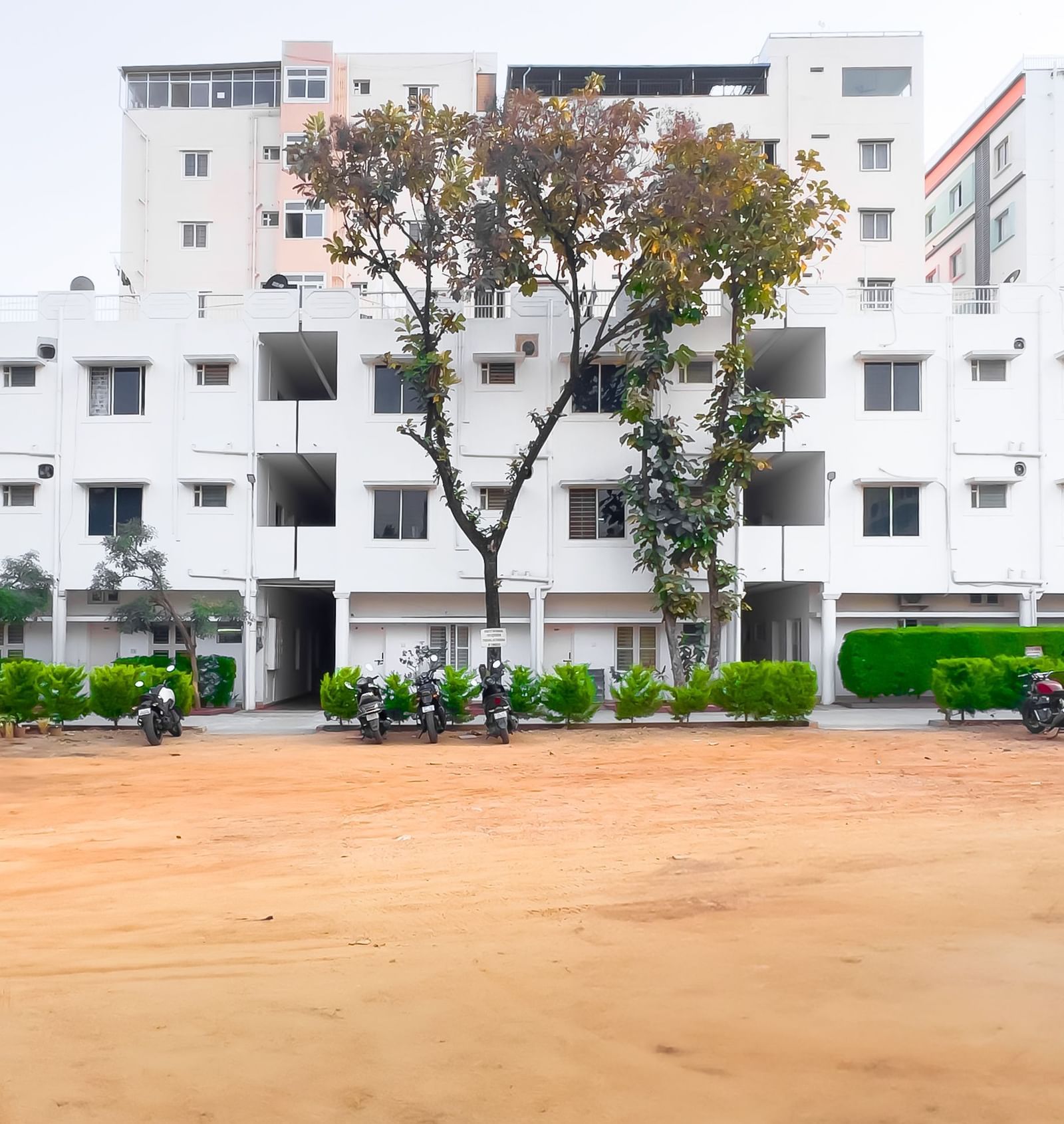 Wide outdoor area with apartment building in the background at The Pinnacle, Electronic City.