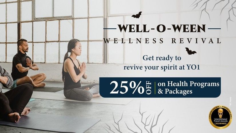 A Halloween Offer banner shows people meditating in a yoga class, promoting a 25% discount on health programs and packages at YO1 Longevity & Health Resorts