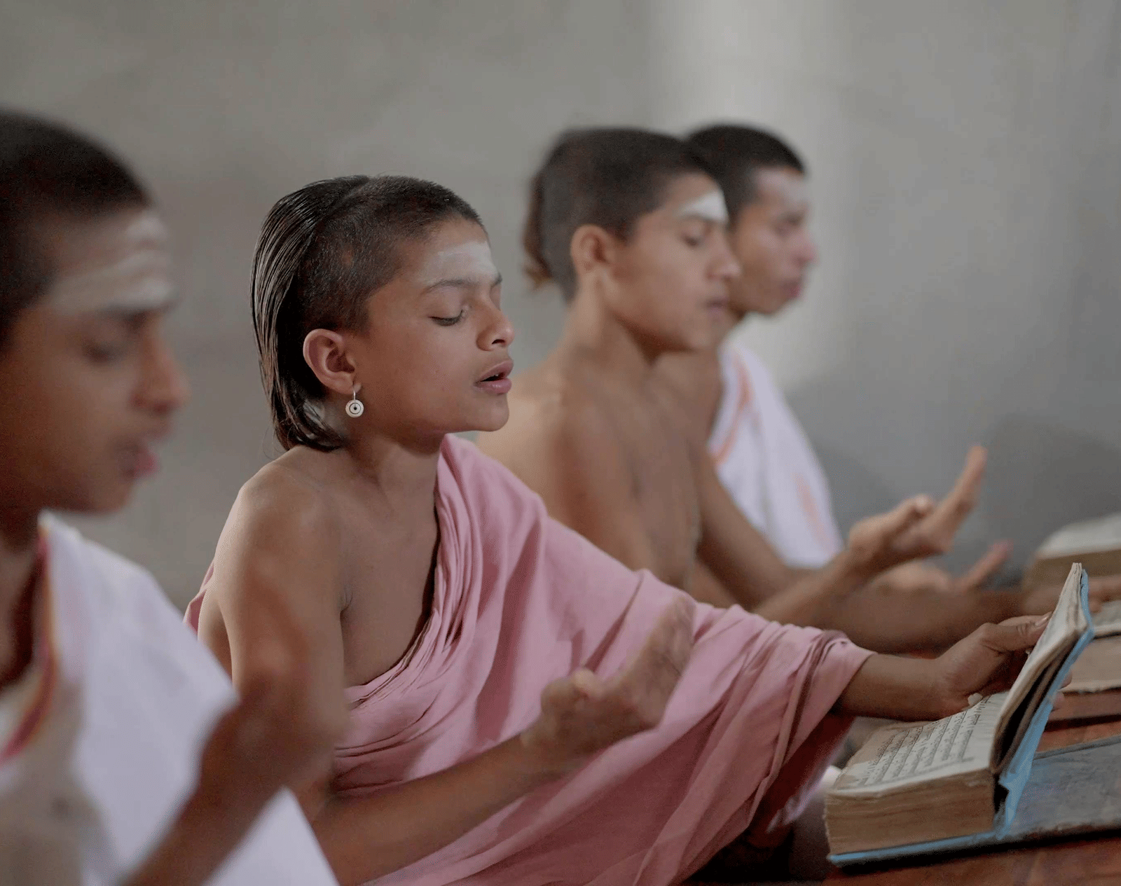 Children studying together in a classroom setting.
