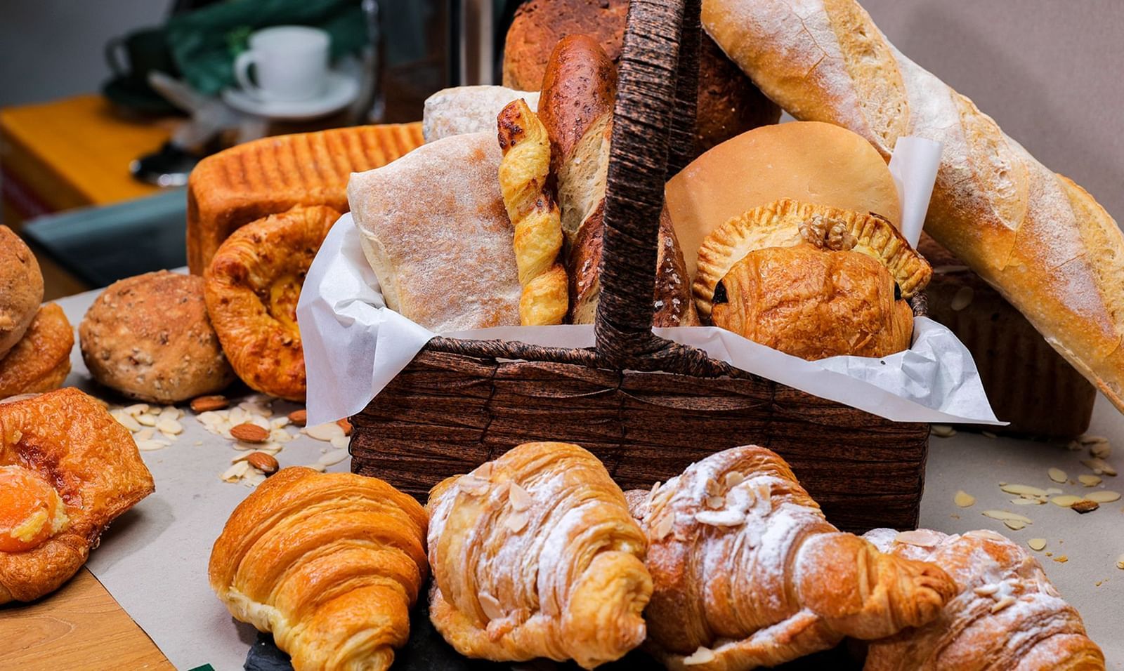 An assortment of pastries and bread on a table | The Shop | Central Mansions, Phnom Penh