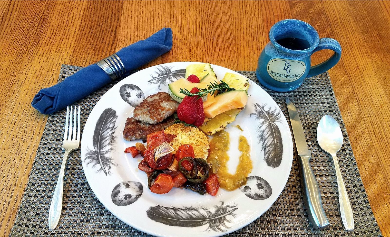 A close-up of a meal featuring fresh vegetables and proteins - Brewery Gulch Inn & Spa