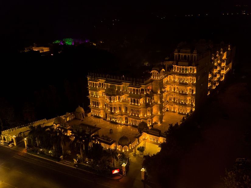 Aerial view of Chunda Hotels in the night with the lights on and darkness in the background